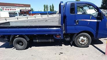 bongo: Kia Bongo III — компактный бортовой грузовик синего цвета. Кузов и — 2