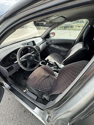 салон на gx470: Nissan Almera: 2003 г., 1.8 л, Механика, Бензин, Хэтчбэк — 5
