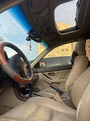 смешанный: Subaru Outback: 2002 г., 2.5 л, Автомат, Газ, Универсал — 2
