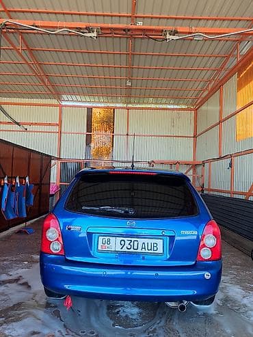 mc 2000: Mazda Familia: 2002 г., 1.6 л, Механика, Бензин, Универсал — 5