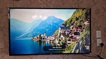Телевизор LG, диагональ экрана около 43–49". Узкие рамки, настенное