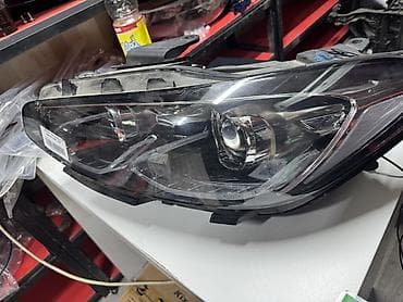 210 фары: Передняя левая фара Mazda — 2