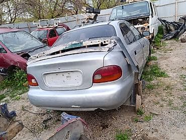 Авторазбор Hyundai Accent (первое поколение, седан, серебристый)