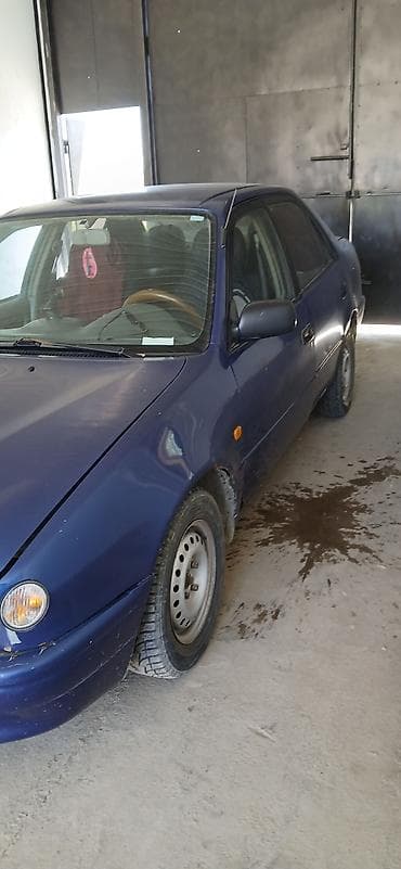 Транспорт: Toyota Corolla: 1995 г., Кол менен иштөөчү, Седан — 7