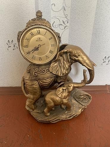 шкатулка для кольца: Настольные часы-скульптура Delixin (Quartz) в виде пары слонов. - — 1