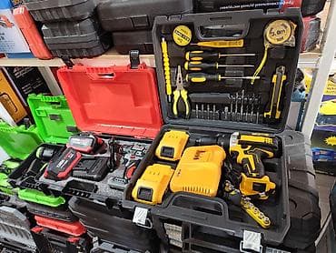 Cordless Tool Kits in Cases Description: - Various professional tool