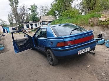 Транспорт: Mazda 323: 1990 г., Седан — 1