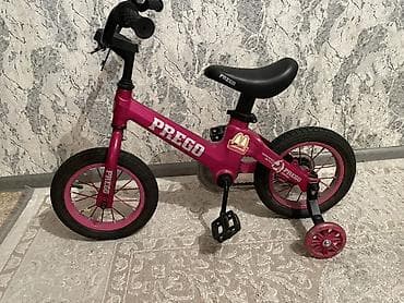 Детский велосипед Prego, розовый. Особенности: - Легкая рама с низкой