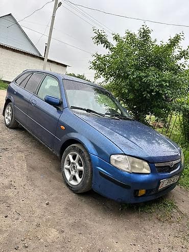 Транспорт: Mazda 323: 2001 г., 1.6 л, Кол менен иштөөчү, Бензин, Хетчбек — 1