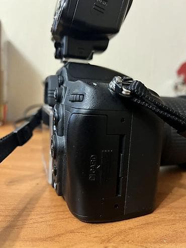 Фото жана видеокамералар: Зеркальная фотокамера Nikon D7000 с универсальным зум-объективом и — 9