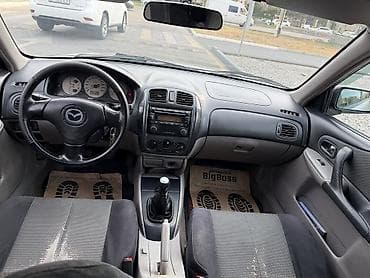 launch 431: Mazda 323: 2003 г., 1.6 л, Механика, Бензин, Универсал — 4