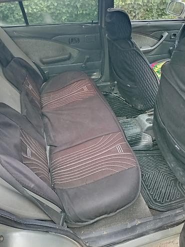 кен булун: Daewoo Nexia: 2004 г., Седан — 4