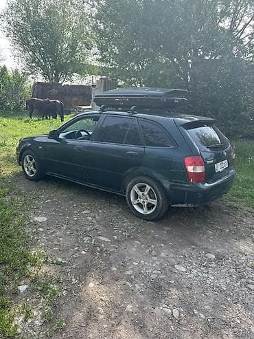 mazda 626 2001: Mazda 323: 1999 г., 1.8 л, Механика, Бензин, Универсал — 3