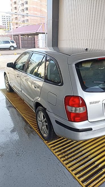 bmb 34: Mazda 323: 2000 г., Механика, Универсал — 2