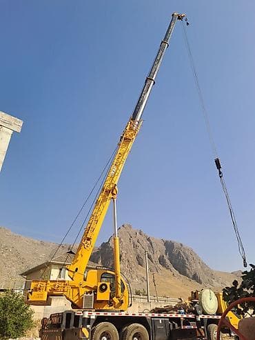 аренда помещения под кухню: Услуги автокрана. - Колёсный автокран жёлтого цвета, телескопическая — 5