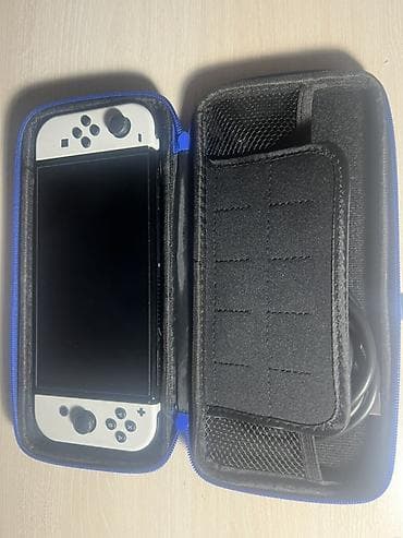 nintendo switch сколько стоит: Игровая консоль Nintendo Switch OLED (белые Joy‑Con) - Экран 7" OLED — 6