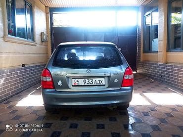 Mazda 323: 2003 г., 1.3 л, Механика, Бензин, Универсал
