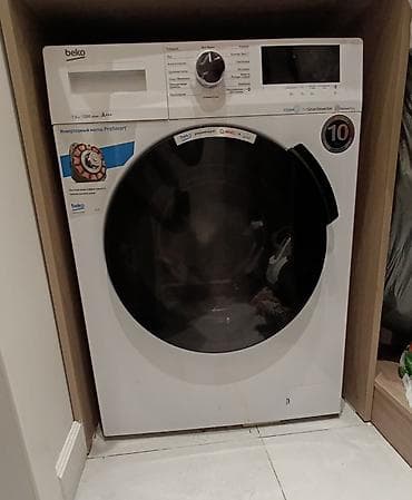 Стиральная машина Beko WSPE 7H 616 W с фронтальной загрузкой. В