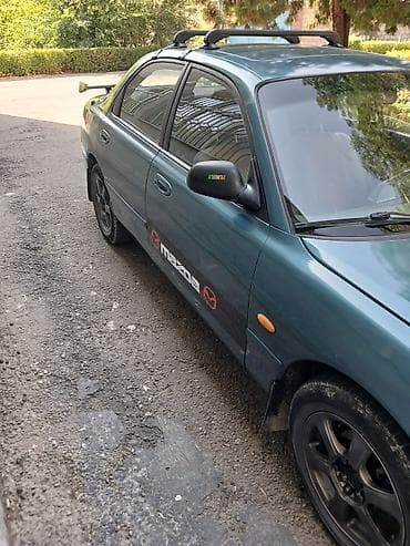 demio бампер: Mazda Cronos: 1993 г., 2 л, Автомат, Бензин, Седан — 3