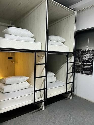 хостел капсульный: Капсульные спальные места с общей кухней и санузлом Описание: - — 2