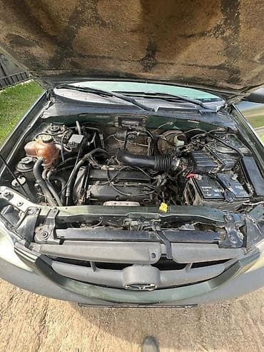 Mazda Tribute: 2002 г., 2 л, Кол менен иштөөчү, Кроссовер — 9