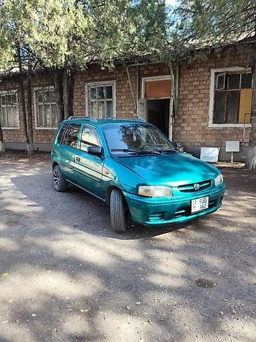 Транспорт: Mazda Demio: 1999 г., 1.3 л, Механика, Бензин, Хэтчбэк — 1