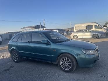 Транспорт: Mazda 323: 2003 г., 1.6 л, Автомат, Бензин, Универсал — 1