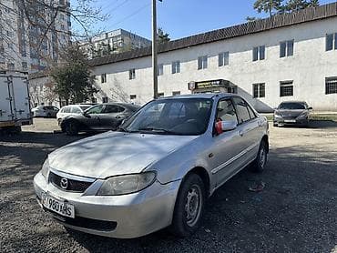 Mazda 323: 2003 г., 1.6 л, Механика, Бензин, Седан