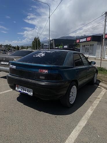Унаа сатуу: Mazda 323: 1994 г., 1.6 л, Кол менен иштөөчү, Бензин, Хетчбек — 3