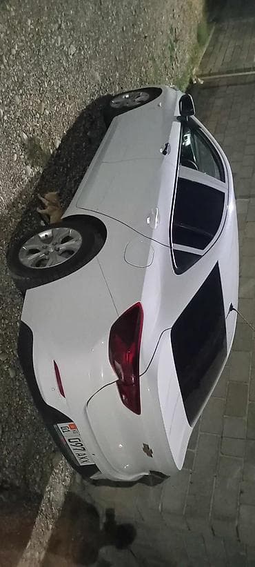 Транспорт: Chevrolet Onix: 2020 г., 1 л, Автомат, Бензин, Седан — 2