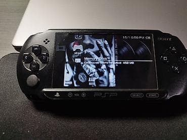 Другие игры и приставки: PSPe1008. прошитый.внутри 16игр. флешка на 8гб. сам он немножко — 1