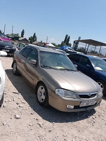 hyundai ionic: Mazda Familia: 1999 г., Автомат, Седан — 2