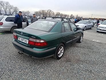 посадка авто: Mazda 626: 1997 г., 1.8 л, Механика, Бензин, Седан — 3