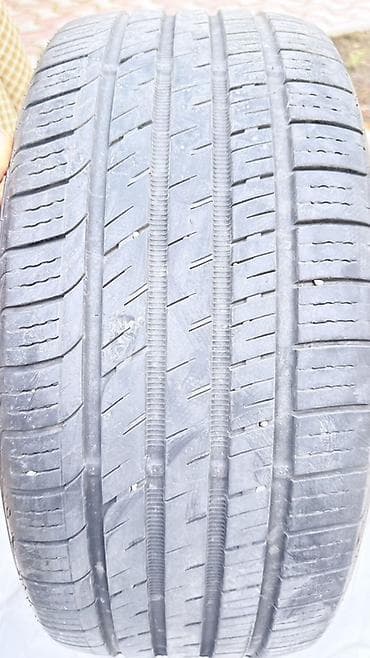 Шины: Летняя/всесезонная шина 235/45 ZR18 98W (усиленная, XL), маркировка — 1