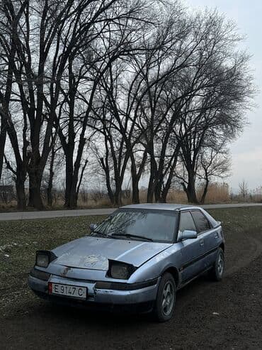 гольы 3: Mazda : 1991 г., 1.6 л, Механика, Бензин, Хэтчбэк — 2