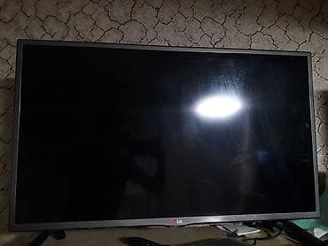 Телевизор LG, диагональ около 32–40" (по фото — широкоформатный