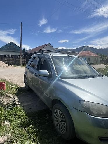 авто чихол: Mazda Demio: 2004 г., Автомат, Бензин, Хэтчбэк — 5