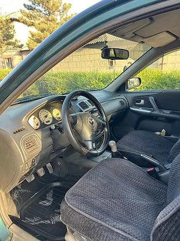2 4 д: Mazda 323: 2000 г., 2 л, Механика, Бензин, Хэтчбэк — 6