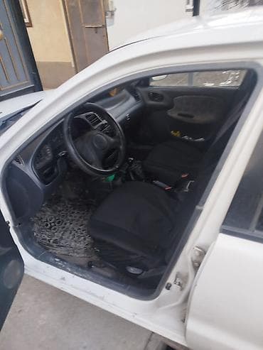 nisan march: Daewoo Lanos: 1998 г., 1.3 л, Механика, Бензин, Седан — 1