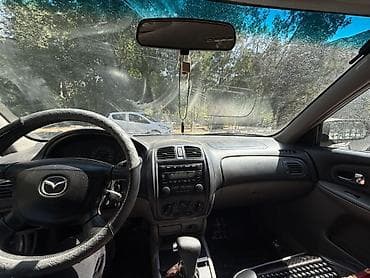 Mazda 323: 2001 г., 1.5 л, Автомат, Бензин, Универсал — 8