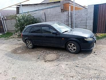 Mazda 323: 2002 г., 1.6 л, Механика, Бензин, Универсал — 1