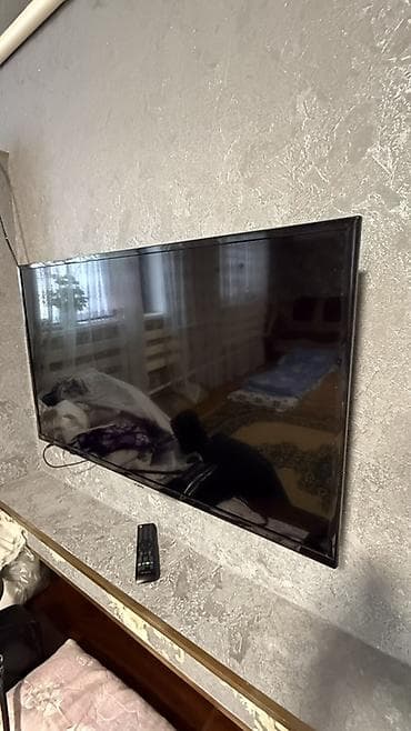 проектор детский: LED‑телевизор VISION, диагональ около 40–43". Тонкая рамка, корпус — 2