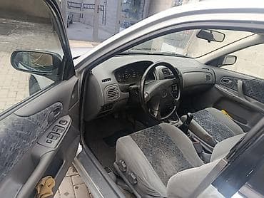 бакту долонотуу: Mazda 323: 2000 г., 1.5 л, Кол менен иштөөчү, Бензин, Хетчбек — 6