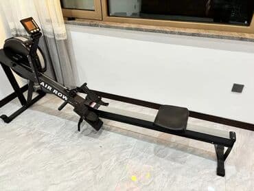 купить эллипсоидный тренажёр: Тренажер-гребля черного цвета с надписью "AIR ROW" на корпусе — 1