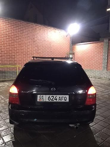 bmw e34 1995: Mazda Familia: 2001 г., Универсал — 3