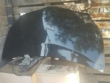 step: Капот для автомобиля, металлический, окрашен в чёрный цвет — 1