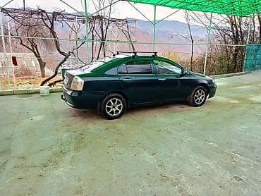 kirgiz auto: Продам седан темно‑зеленого цвета с багажными рейлингами на крыше — 1