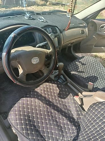 купить моторную лодку: Mazda Familia: 2001 г., Автомат, Седан — 4