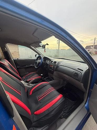 Унаа: Mazda 323: 2003 г., 1.6 л, Кол менен иштөөчү, Бензин, Хетчбек — 4