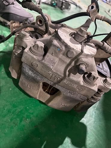 Задний левый суппорт Kia 2018 г., Оригинал